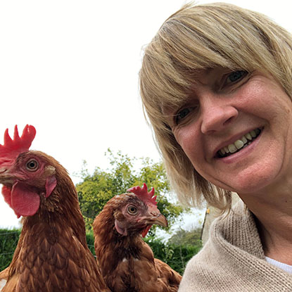 Photo of Deborah with two chickens